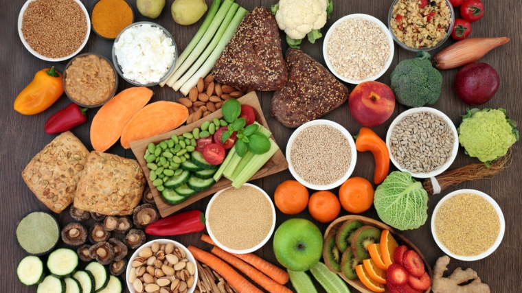 A display of various grains, fruits and vegetables.