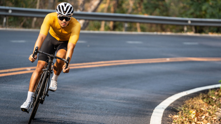 A person cycling on the road.