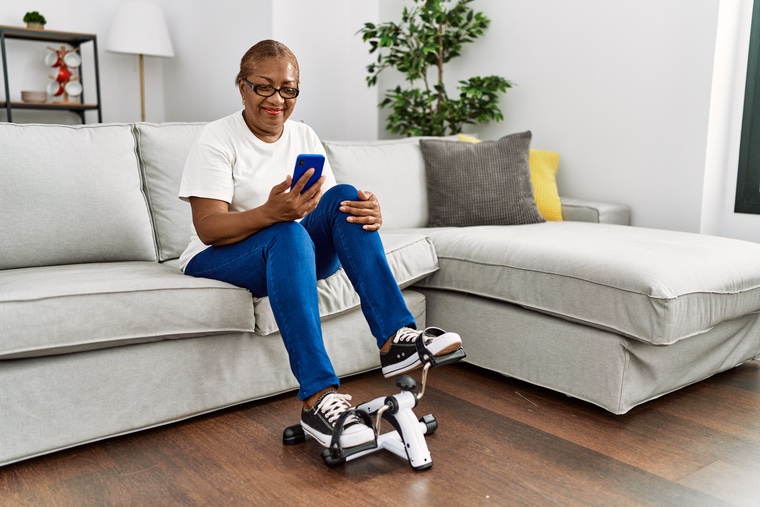 Woman using a mini exercise bike.