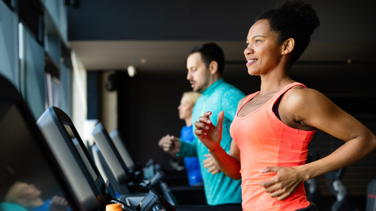 A fit individual running on a treadmill.