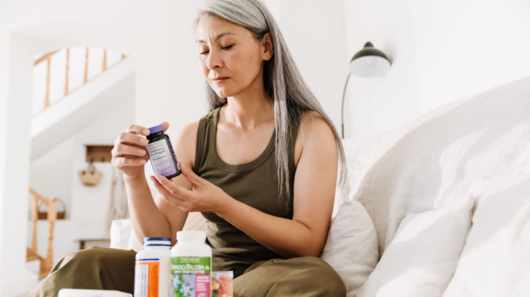 A person taking their medication.