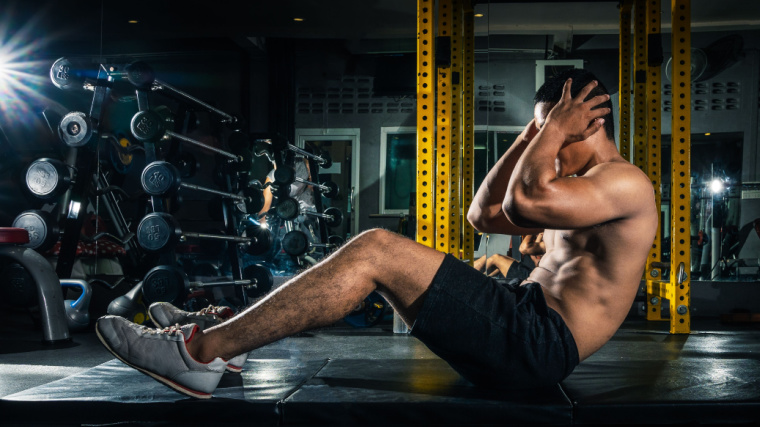 A fit individual working out in the gym.