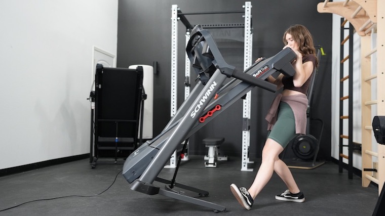 Our tester setting up a Schwinn 810 Treadmill in the gym