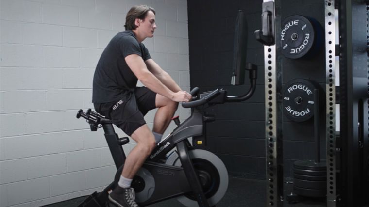 A person working out on an exercise bike.