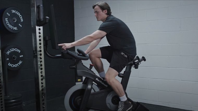 A person working out on an exercise bike.